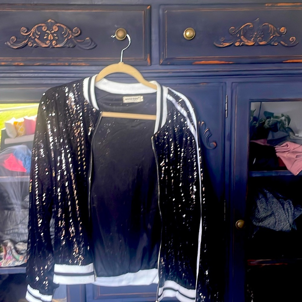 Black sequined jacket for a night out or with jeans. Never worn.